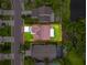 Overhead shot showing the property layout with green lawn, driveway, and surrounding neighborhood at 5016 Cypress Trace Dr, Tampa, FL 33624