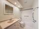 Bathroom with vanity sink and a shower over tub with safety bars at 5016 Cypress Trace Dr, Tampa, FL 33624