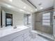 Bathroom offers updated walk-in shower with tile surround and large sink at 5016 Cypress Trace Dr, Tampa, FL 33624