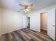 Cozy bedroom with ceiling fan, closet, and modern floors at 5016 Cypress Trace Dr, Tampa, FL 33624