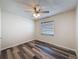 Bedroom with new flooring, neutral paint, and ceiling fan at 5016 Cypress Trace Dr, Tampa, FL 33624