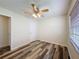 Well-lit bedroom featuring modern flooring and a window for natural light at 5016 Cypress Trace Dr, Tampa, FL 33624