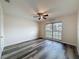 Bright bedroom with a ceiling fan and a large window at 5016 Cypress Trace Dr, Tampa, FL 33624
