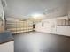 Spacious garage with painted floors, storage cabinets, and an automatic door at 5016 Cypress Trace Dr, Tampa, FL 33624