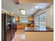 Bright kitchen featuring wood cabinets, modern appliances, and ample counter space at 5016 Cypress Trace Dr, Tampa, FL 33624