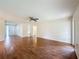 Large living room with hardwood floors, ceiling fan, and neutral walls offers versatile space at 5016 Cypress Trace Dr, Tampa, FL 33624