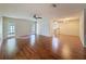 Spacious living room featuring hardwood floors, ceiling fan, and french doors to a patio at 5016 Cypress Trace Dr, Tampa, FL 33624