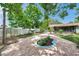 Landscaped backyard with a decorative paver patio at 5053 18Th St, Zephyrhills, FL 33542
