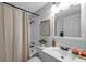 Bright bathroom featuring a shower-tub combo and a modern vanity at 5053 18Th St, Zephyrhills, FL 33542