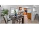 An eat-in kitchen featuring dark wood table set, and wood cabinetry at 5053 18Th St, Zephyrhills, FL 33542