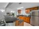 Kitchen with tile floors and stainless steel appliances and bar seating at 5053 18Th St, Zephyrhills, FL 33542