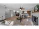 Open-concept living area with tile floors flowing into dining and kitchen spaces at 5053 18Th St, Zephyrhills, FL 33542