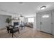 Bright living room featuring a decorative fireplace, neutral tones, and tile flooring at 5053 18Th St, Zephyrhills, FL 33542