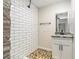 Bathroom with subway tile shower, stone accents, and a modern vanity at 5106 Five Acre Rd, Plant City, FL 33565