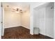 Bright bedroom featuring hardwood floors, a ceiling fan, and ample closet space at 5106 Five Acre Rd, Plant City, FL 33565