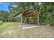 Outdoor carport features sturdy beams and concrete foundation, perfect for vehicle or equipment storage at 5106 Five Acre Rd, Plant City, FL 33565