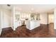 Stylish kitchen features a central island, stainless steel appliances, and sleek white cabinets at 5106 Five Acre Rd, Plant City, FL 33565