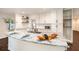 This modern kitchen features granite countertops, white cabinets, and a stylish island at 5106 Five Acre Rd, Plant City, FL 33565