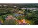 An aerial view of a beautiful single Gathering home surrounded by lush greenery and trees at 512 Creekside Ct, Safety Harbor, FL 34695
