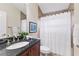 Cozy bathroom features a vanity with granite countertop and a shower and tub combination at 512 Creekside Ct, Safety Harbor, FL 34695