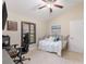 Charming bedroom featuring a vaulted ceiling, comfortable furnishings, and a window with views at 512 Creekside Ct, Safety Harbor, FL 34695