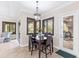 Cozy dining area with traditional wood table, chairs, and an elegant chandelier that has a serene atmosphere at 512 Creekside Ct, Safety Harbor, FL 34695