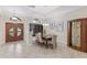 Inviting dining room features a chandelier, elegant furniture, and tiled floors at 512 Creekside Ct, Safety Harbor, FL 34695