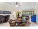 Large game room featuring a pool table, game table with leather chairs, and a wet bar for entertainment at 512 Creekside Ct, Safety Harbor, FL 34695