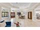Open living area with tiled floors and an open view of the dining room and kitchen at 512 Creekside Ct, Safety Harbor, FL 34695