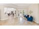 Open living area featuring tile floors and stylish seating with a view of the pool at 512 Creekside Ct, Safety Harbor, FL 34695