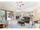 Open-concept living room flows to patio, kitchen and dining areas providing abundant space and natural light at 512 Creekside Ct, Safety Harbor, FL 34695