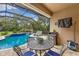 Outdoor dining and seating area by the pool, perfect for outdoor gatherings and leisure at 512 Creekside Ct, Safety Harbor, FL 34695