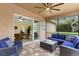 Comfortable screened-in patio with stylish furniture, providing an ideal outdoor living space at 512 Creekside Ct, Safety Harbor, FL 34695
