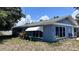 Charming single-story home with a blue exterior, awning-covered window, and partially landscaped yard at 5719 13Th E St, Bradenton, FL 34203