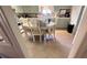 Spacious kitchen with adjacent dining area, showcasing tile flooring and natural light at 5719 13Th E St, Bradenton, FL 34203