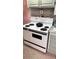 Kitchen with a charming vintage white range and brick backsplash, adding character and warmth at 5719 13Th E St, Bradenton, FL 34203