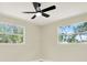 Bedroom with a ceiling fan and natural light at 6220 Pershing Ne St, St Petersburg, FL 33702