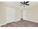 Bright bedroom with ample closet space and laminate wood flooring at 6220 Pershing Ne St, St Petersburg, FL 33702