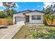 Charming home with a well-maintained lawn, updated garage, and welcoming front entrance at 6220 Pershing Ne St, St Petersburg, FL 33702