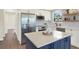 Modern kitchen with stainless steel appliances, custom cabinets, and a quartz countertop island at 6220 Pershing Ne St, St Petersburg, FL 33702