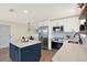 Bright kitchen with stainless steel refrigerator and modern appliances at 6220 Pershing Ne St, St Petersburg, FL 33702