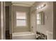 Cozy bathroom showcasing a tiled shower-tub combination and undergoing renovations at 647 74Th N Ave, St Petersburg, FL 33702