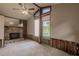 The large living room features a stone fireplace, wood paneling, and large windows at 647 74Th N Ave, St Petersburg, FL 33702