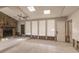 Bright living room with stone fireplace, tile floors, and natural light, perfect for updating at 647 74Th N Ave, St Petersburg, FL 33702