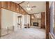 Living room featuring a stone fireplace and wood paneled walls and ceiling at 647 74Th N Ave, St Petersburg, FL 33702