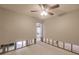 Open-concept living room featuring ceiling fan and view to the backyard at 647 74Th N Ave, St Petersburg, FL 33702