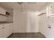 Versatile room with cabinetry and laundry hookups, ideal for conversion to a mudroom or storage area at 647 74Th N Ave, St Petersburg, FL 33702