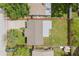 Aerial view showcases the property's layout and backyard, outlined in red, revealing its dimensions at 6941 58Th N Way, Pinellas Park, FL 33781