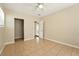 Bedroom with tile flooring, neutral walls, ceiling fan, and closet at 6941 58Th N Way, Pinellas Park, FL 33781