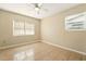 Bedroom with tile flooring, neutral walls, ceiling fan, and natural light at 6941 58Th N Way, Pinellas Park, FL 33781